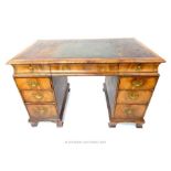 From the estate of Lady Wanda Boothby; a 19th century walnut pedestal desk, with inset leather