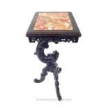 A Chinese rectangular topped table with marble inlay, with a carved dragon support raised above