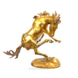 An early 20th century, large cast brass statue of a wild stallion; overall height 49cm.