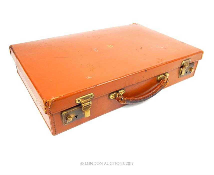 From the estate of the late Lady Wanda Boothby: a tan leather attache case with embossed initial "B"