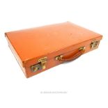 From the estate of the late Lady Wanda Boothby: a tan leather attache case with embossed initial "B"