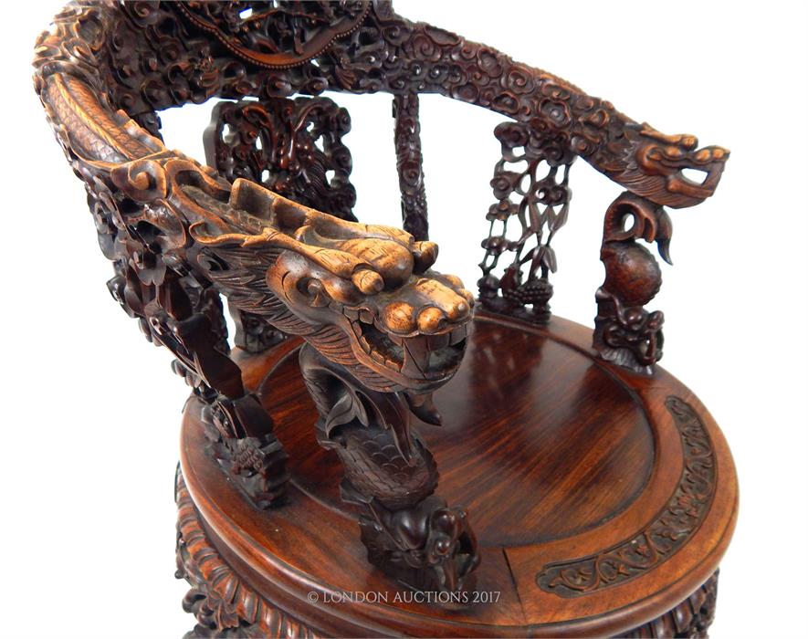 A late 19th century Chinese carved hardwood elbow chair with both armrests carved with dragons, a - Image 4 of 4