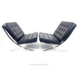 A pair of stylish, Barcelona- style chairs on chromed supports