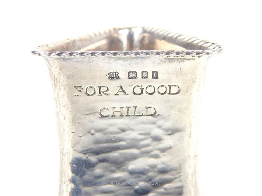 From the estate of Lady Wanda Boothby: a 20th century silver engraved triangular form napkin ring; - Image 2 of 2