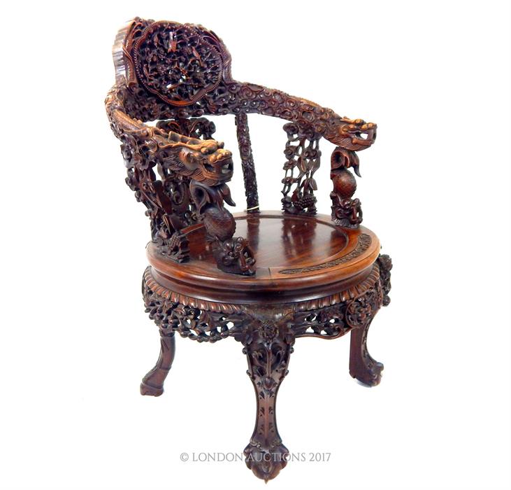 A late 19th century Chinese carved hardwood elbow chair with both armrests carved with dragons, a - Image 2 of 4