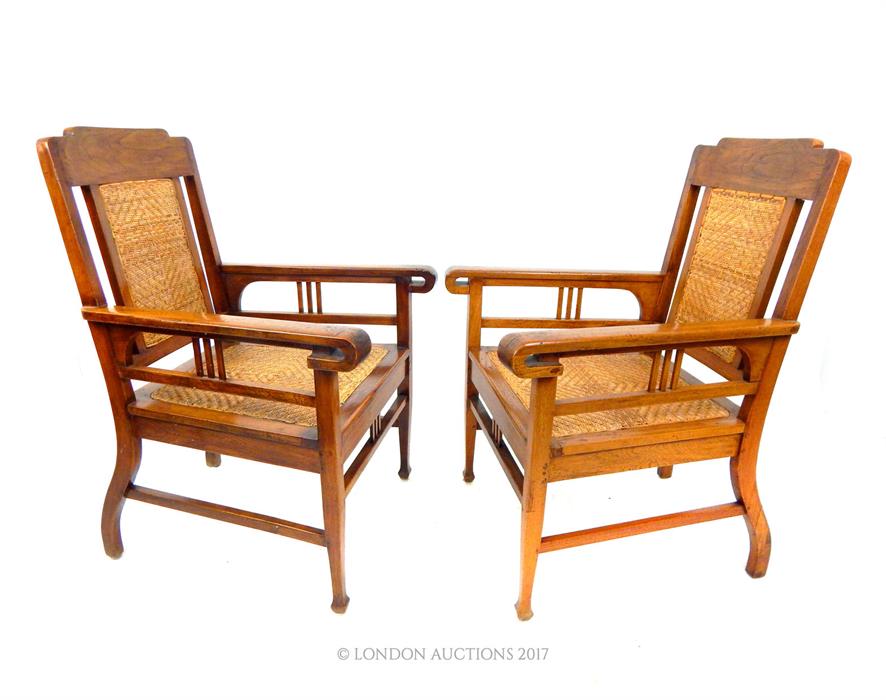 A pair of Dutch Indonesian teak chairs with rattan seats. - Image 2 of 2