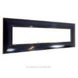 A large horizontal Andrew Martin mirror with a gilt edged ebonized frame; overall size 82cm x