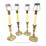 A set of four 19th century silver plated candlesticks