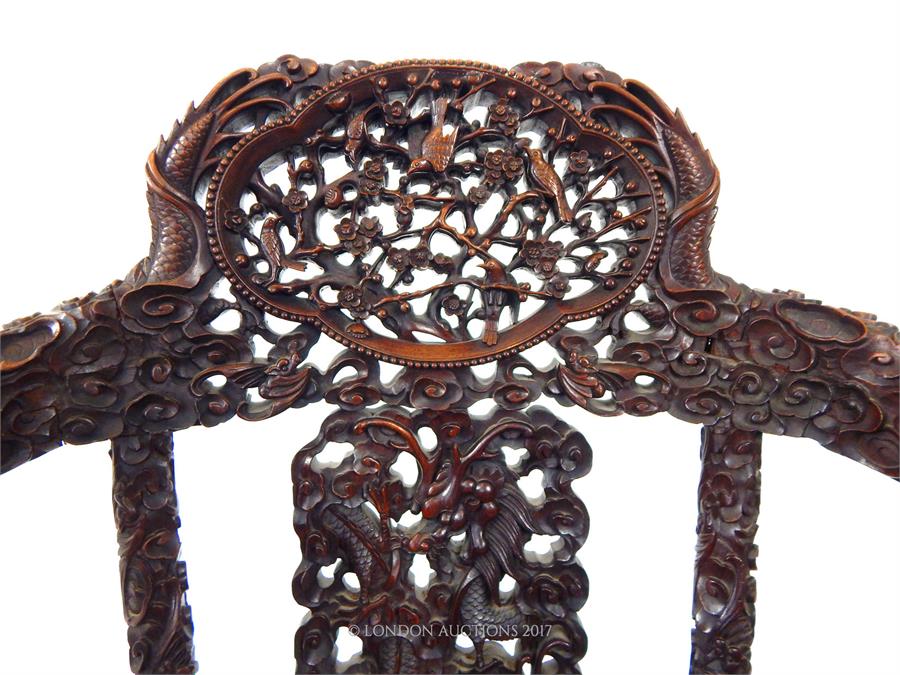 A late 19th century Chinese carved hardwood elbow chair with both armrests carved with dragons, a - Image 3 of 4