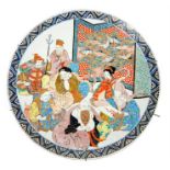 A Japanese charger decorated with various several seated figures; 45cm diameter.