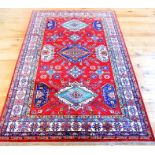 A Russian kazak rug; 267cm x 188cm.