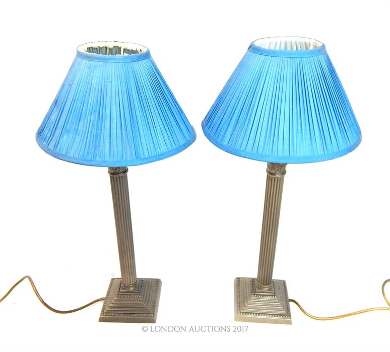 From the estate of the late Lady Wanda Boothby: a pair of white metal electric lamps with Corinthian