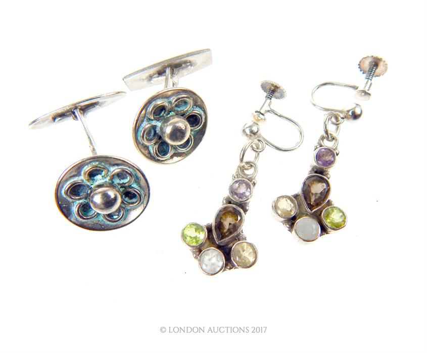 A pair of silver cuff links and a pair of silver earrings