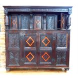 A large antique country made oak court cupboard