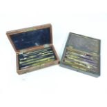 Two vintage geometry sets in wooden cases (one a/f).