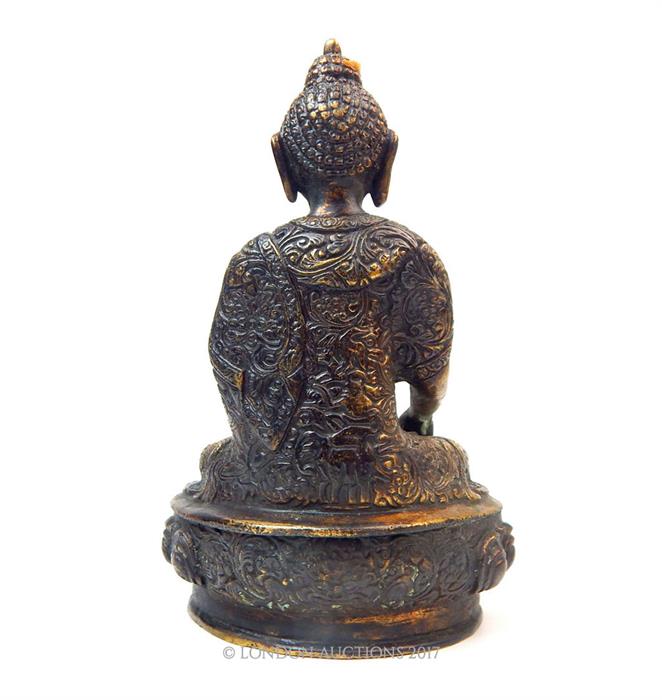 A gilt Bronze Buddha, seated holding a cup; 19.5cm high. - Image 2 of 2