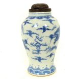 A Chinese blue and white ginger jar with hardwood lid; 22cm.