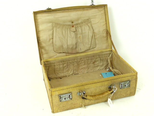 An early 20th century velum suitcase