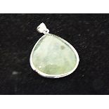 A large, sterling silver and green quartz, tear-drop shaped pendant