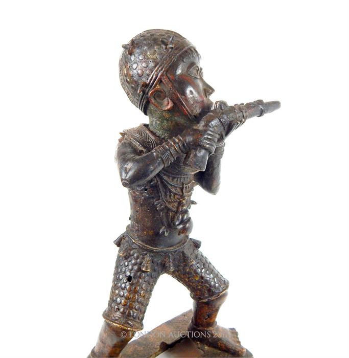 A Benin bronze figure of a man firing a gun - Image 6 of 6