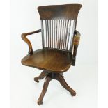 An early 20th century oak office chair
