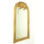 A large Victorian pier mirror with ornate gilt frame; overall size 177cm x 81cm.