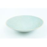 A Chinese celadon style bowl; 20.5cm diameter.