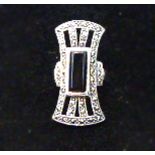 An Art Deco style silver and onyx ring.