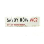 An original, Savoy Row WC2 City of Westminster, enamel road sign with wear and some areas of rust