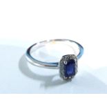 An 18ct white gold sapphire and diamond ring.