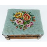 An attractive, early 20th century, oak and needlepoint-covered foot stool