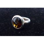 A sterling silver, chunky, faceted, smokey topaz ring