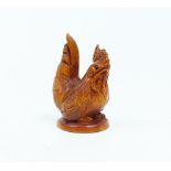 A carved wooden netsuke of a cockerel, signed base.