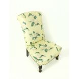 A 19th century, nurse's chair, covered in a charming floral chintz fabric
