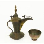 An early 20th century, Middle Eastern metal coffee pot and a cup, possibly Turkish or Persian.