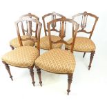 Five Victorian inlaid mahogany dining chairs.