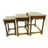 A nest of three, oak tables