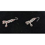 A pair of sterling silver and garnet, drop earrings