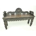 A Victorian carved oak bench; 120cm wide and with an overall height of 79cm.