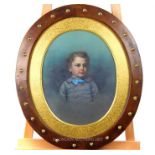 A 19th century oval portrait of a young boy; sight size 41.5cm oval.