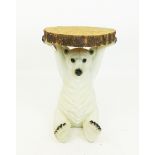 A rustic occasional table in the form of a polar bear