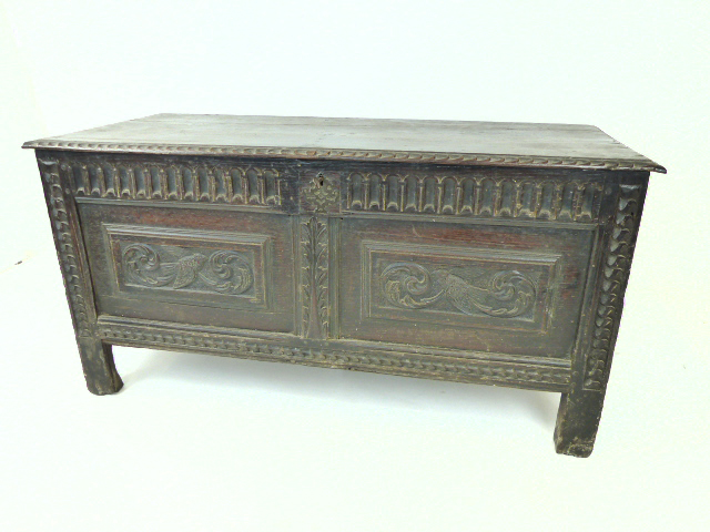 An 18th/19th century oak coffer with lock; 122cm wide.