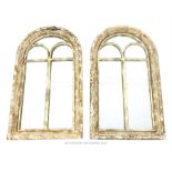 A pair of rounded arch mirrors