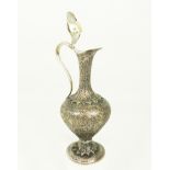 A 19th Century, Cashmere white metal claret jug with handle shaped as a cobra.