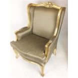 A contemporary gilt framed armchair in the French style