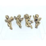 Four gilt plaster putti wall hanging figures; each approximately 13cm high.