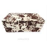 A faux cow skin rectangular stool