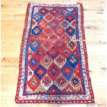 An antique Kazak rug