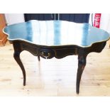 An early 19th century black painted French centre table