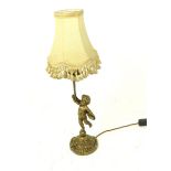 A brass table lamp with a decorative putti support; overall height 47cm.